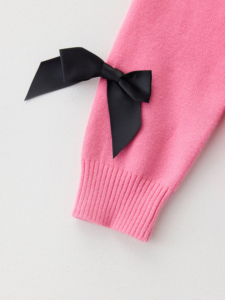 كنزة محبوكة مزينة ببيونات