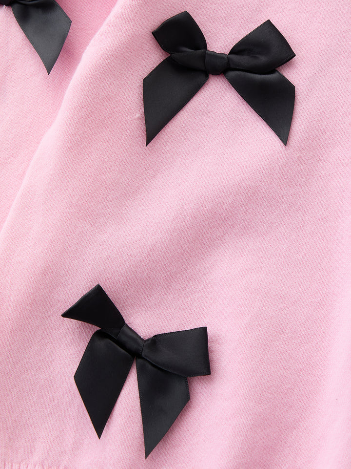 كنزة محبوكة مزينة ببيونات