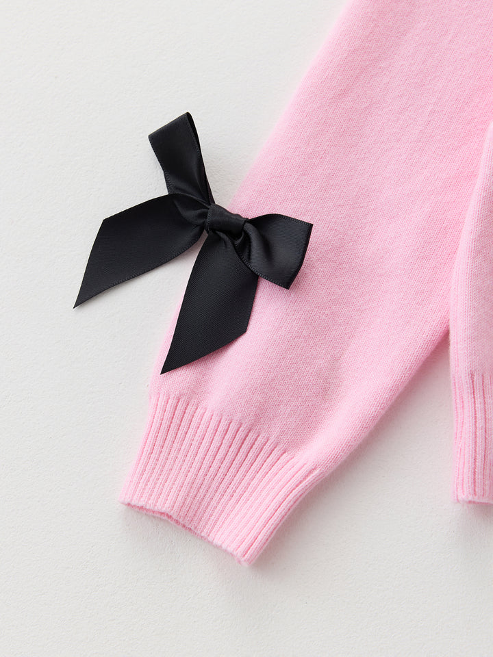 كنزة محبوكة مزينة ببيونات